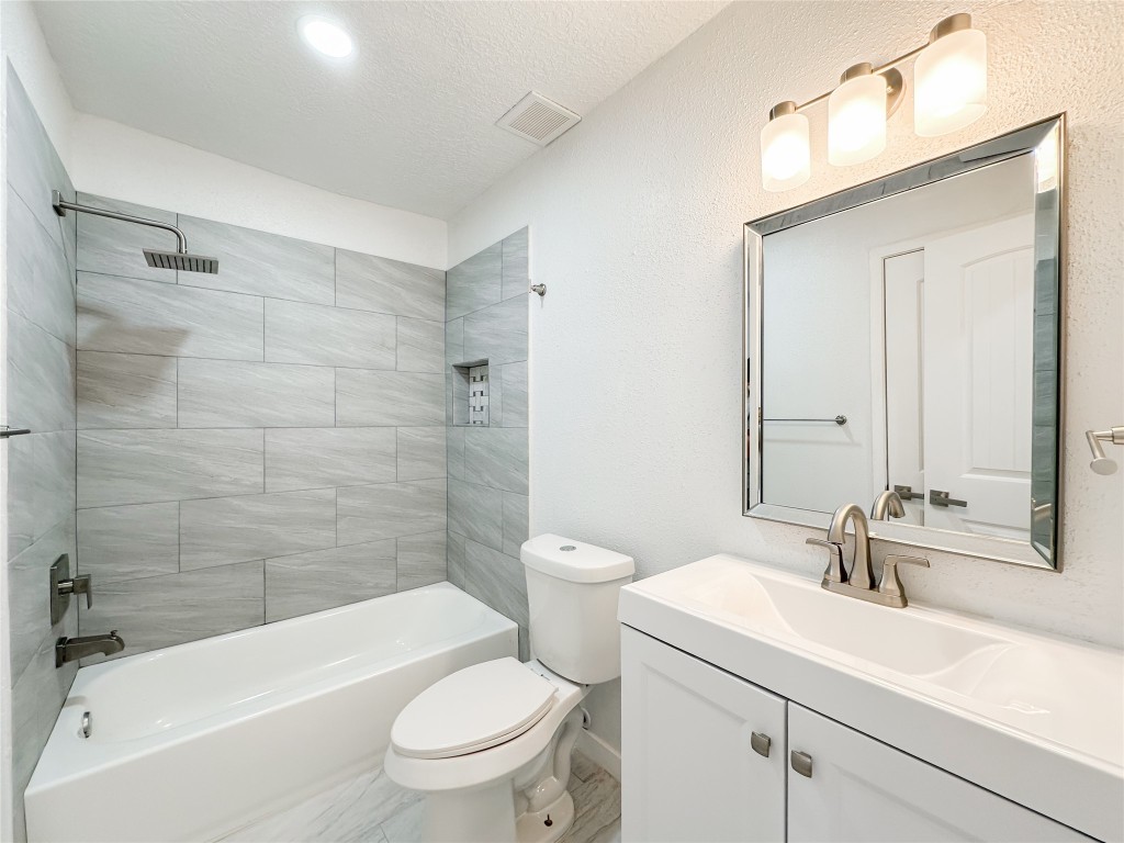 22103 Diane Drive Spring, TX 77373 - Photo 19 of 23 a bathroom with a sink a toilet and shower