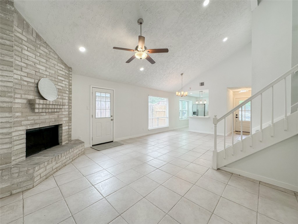 22103 Diane Drive Spring, TX 77373 - Photo 5 of 23 an empty room with windows and fireplace