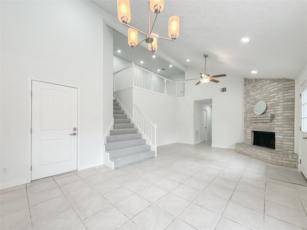 22103 Diane Drive Spring, TX 77373 - Photo 6 of 23 an entryway and livingroom with fireplace