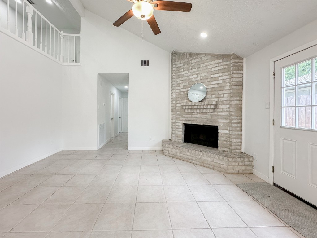 22103 Diane Drive Spring, TX 77373 - Photo 7 of 23 a view of an empty room with a fireplace and a window
