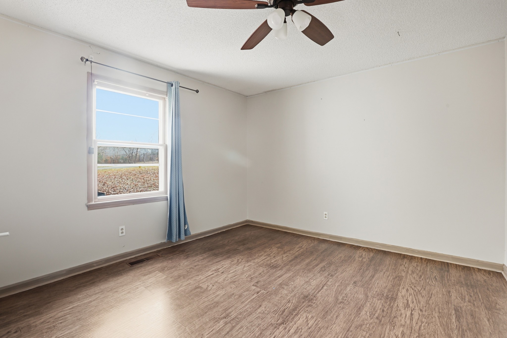 888 Cook Road Tullahoma, TN 37388 - Photo 11 of 23 wooden floor in an empty room with a window