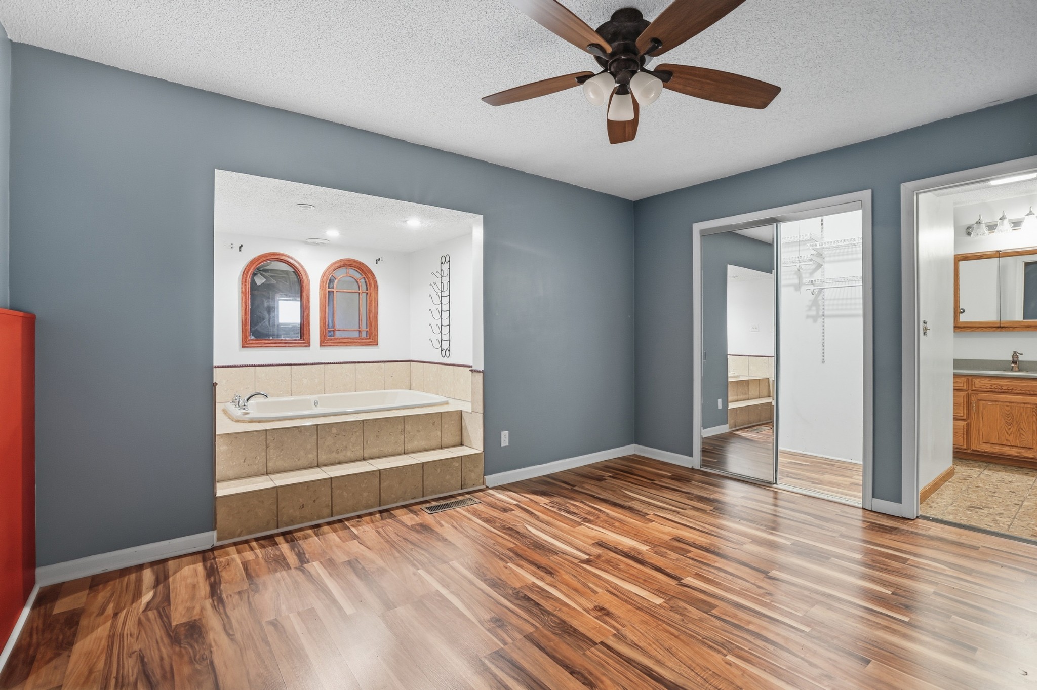 888 Cook Road Tullahoma, TN 37388 - Photo 18 of 23 a view of a livingroom with wooden floor and a ceiling fan