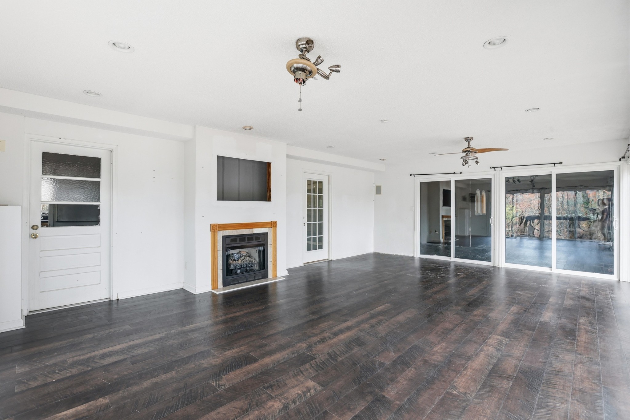888 Cook Road Tullahoma, TN 37388 - Photo 7 of 23 a view of an empty room with a fireplace and a window