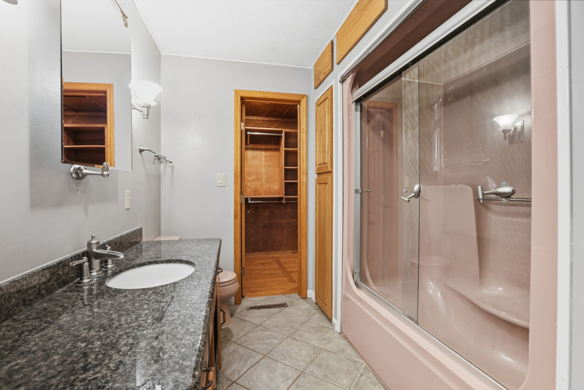 888 Cook Road Tullahoma, TN 37388 - Photo 10 of 23 a bathroom with a granite countertop sink and a mirror