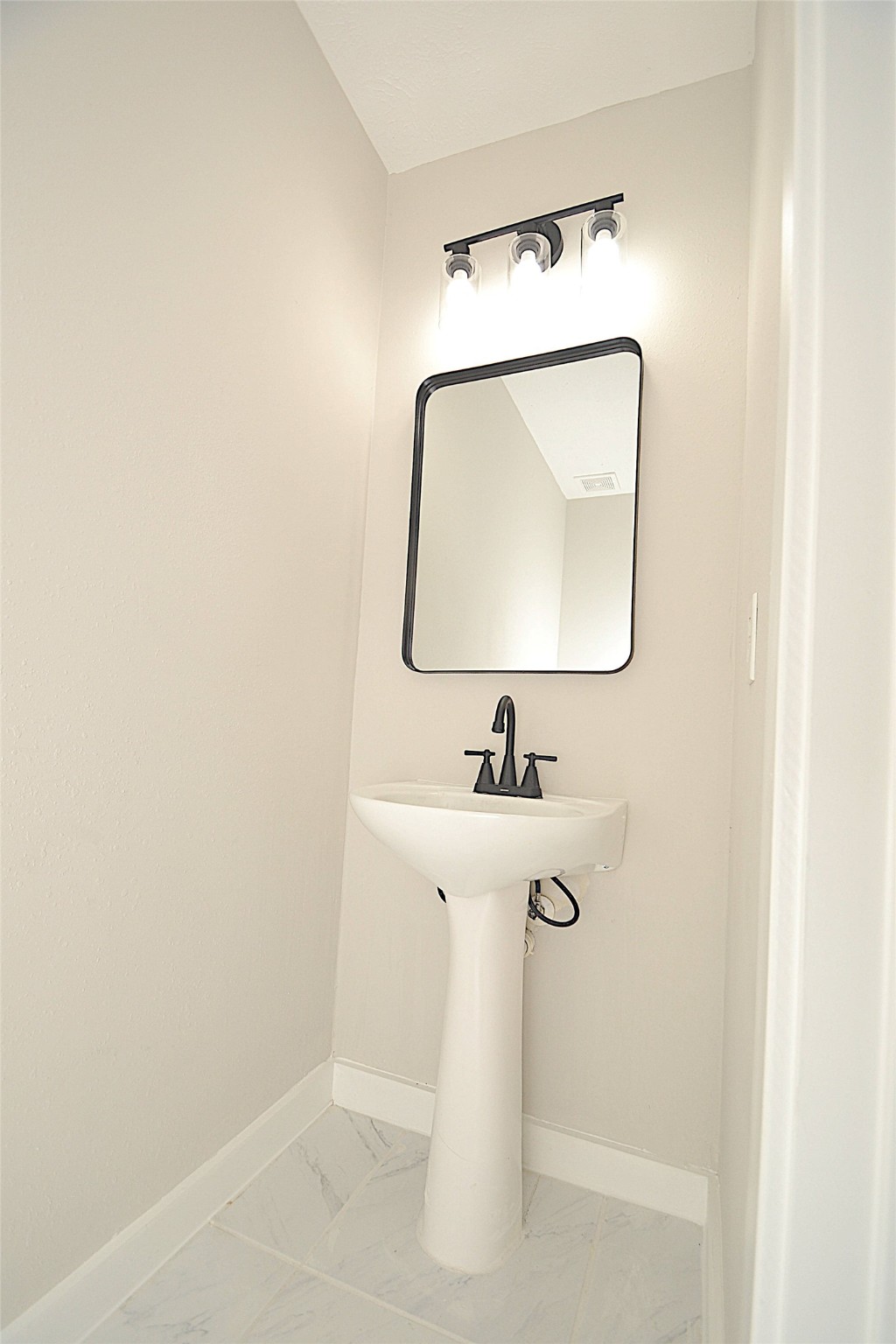 631 Aweigh Drive Crosby, TX 77532 - Photo 13 of 15 a bathroom with a sink and a mirror