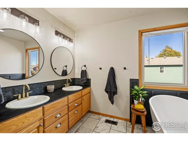 a bathroom with a granite countertop sink mirror and vanity