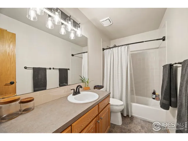 a view of an empty room and wooden floor
