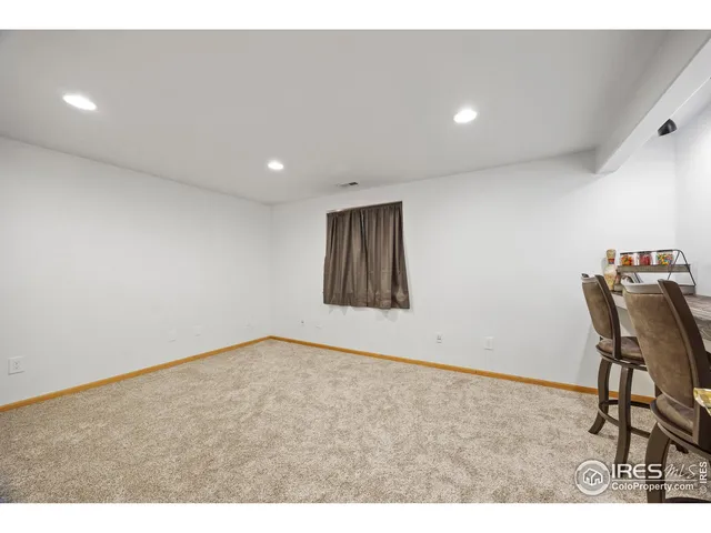 a bedroom with a bed and a mirror