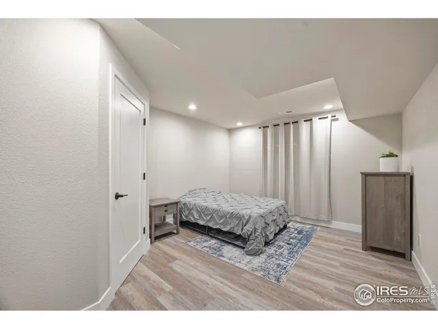 a bathroom with a shower sink vanity and mirror