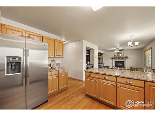 a kitchen with kitchen island a counter top space cabinets and stainless steel appliances