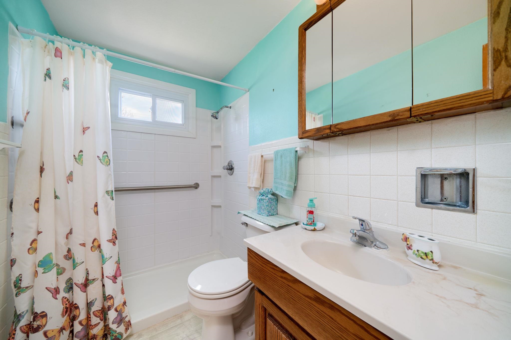 1611 Notre Dame Road Rockford, IL 61103 - Photo 18 of 33 a bathroom with a sink toilet and shower