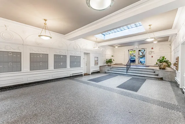 a view of a hall way with furniture