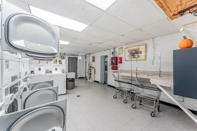a view of a livingroom with furniture and staircase