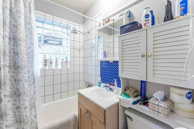 a white refrigerator freezer sitting inside of a kitchen