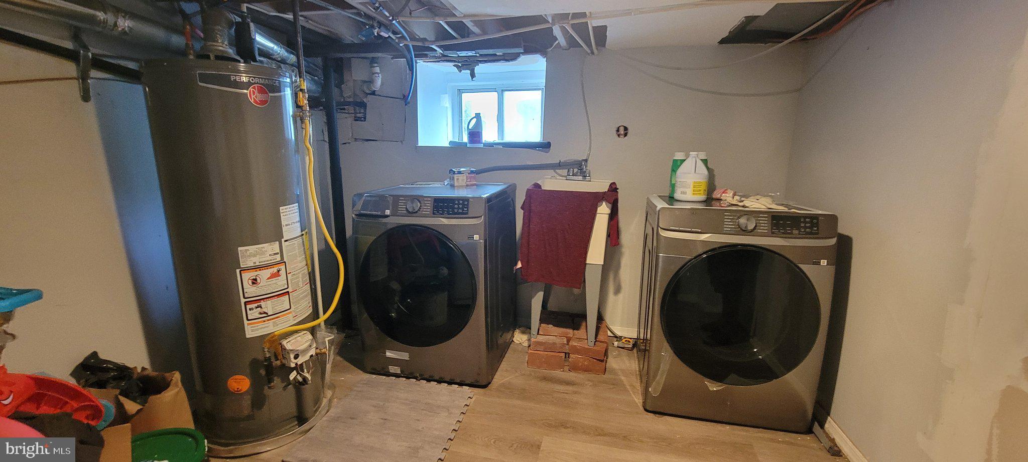 209 North 10th Street Darby, PA 19023 - Photo 15 of 26 Modern laundry space with utility charm.