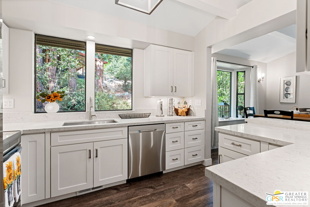 53615 Silver Fir Drive Idyllwild, CA 92549 - Photo 13 of 49 a kitchen with sink cabinets and wooden floor