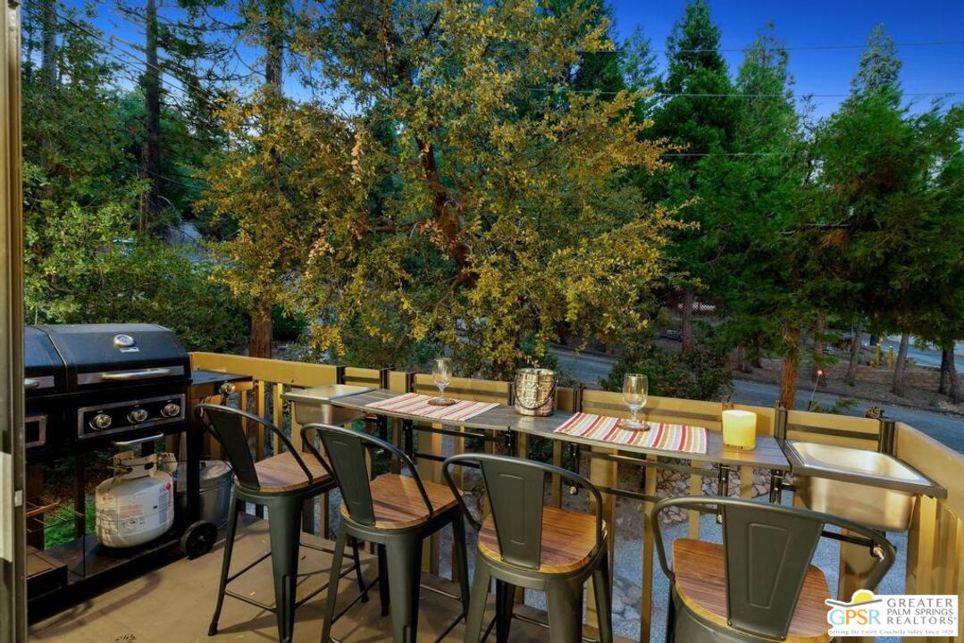 53615 Silver Fir Drive Idyllwild, CA 92549 - Photo 20 of 49 a view of a dinning table and chairs in the patio