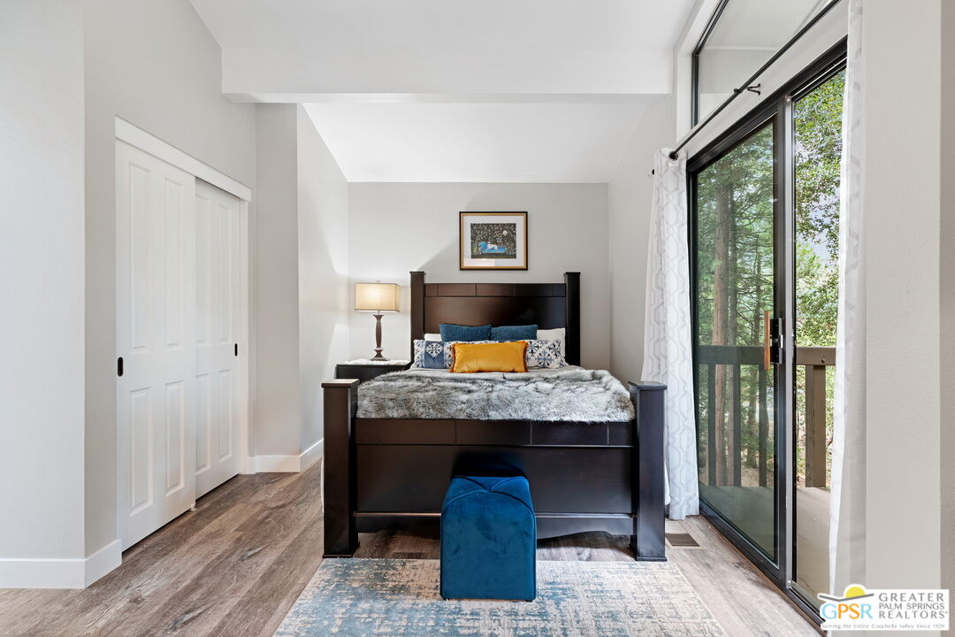 53615 Silver Fir Drive Idyllwild, CA 92549 - Photo 25 of 49 a bedroom with a bed and wooden floor