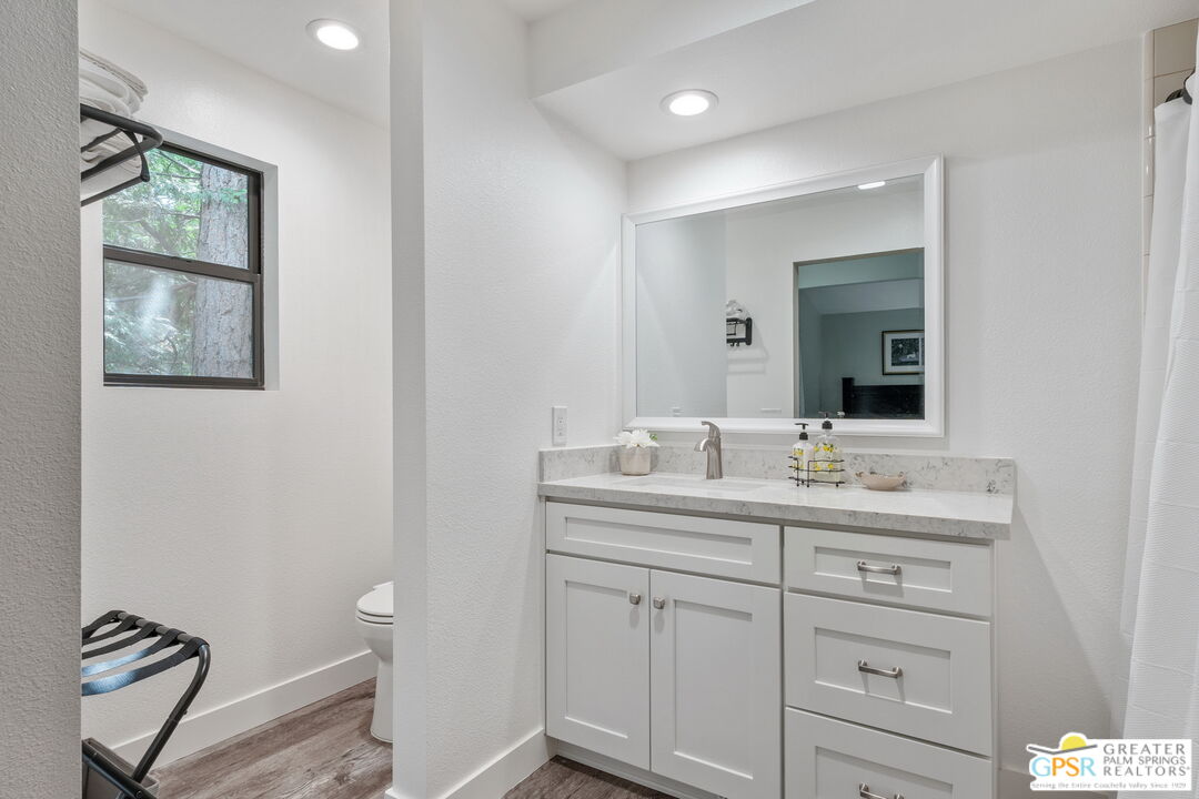 53615 Silver Fir Drive Idyllwild, CA 92549 - Photo 29 of 49 a bathroom with a double vanity sink and a mirror