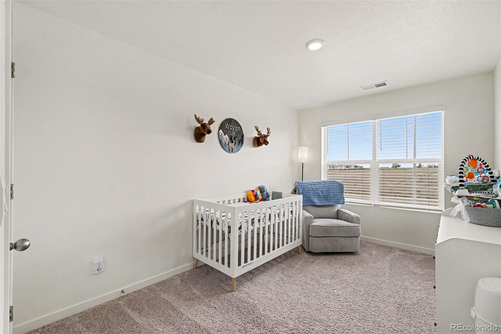 7008 Kali Court Frederick, CO 80530 - Photo 15 of 28 a bedroom with a bed and a window