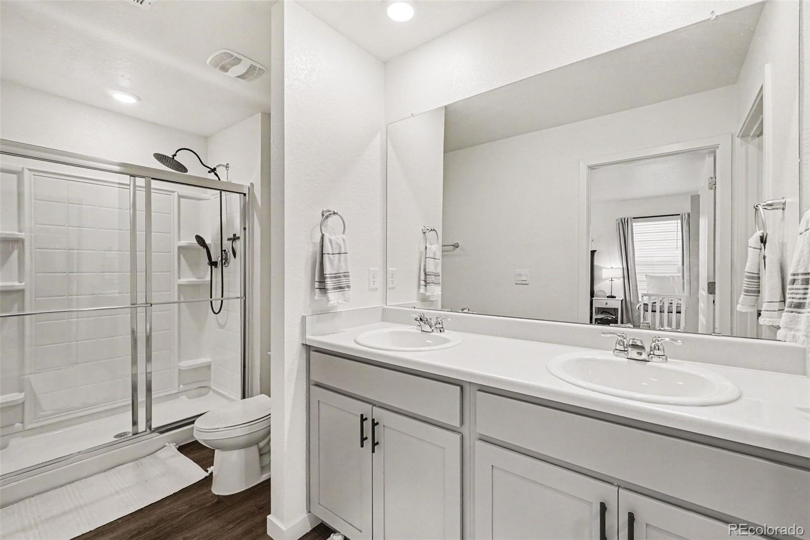7008 Kali Court Frederick, CO 80530 - Photo 16 of 28 a bathroom with a sink toilet and shower