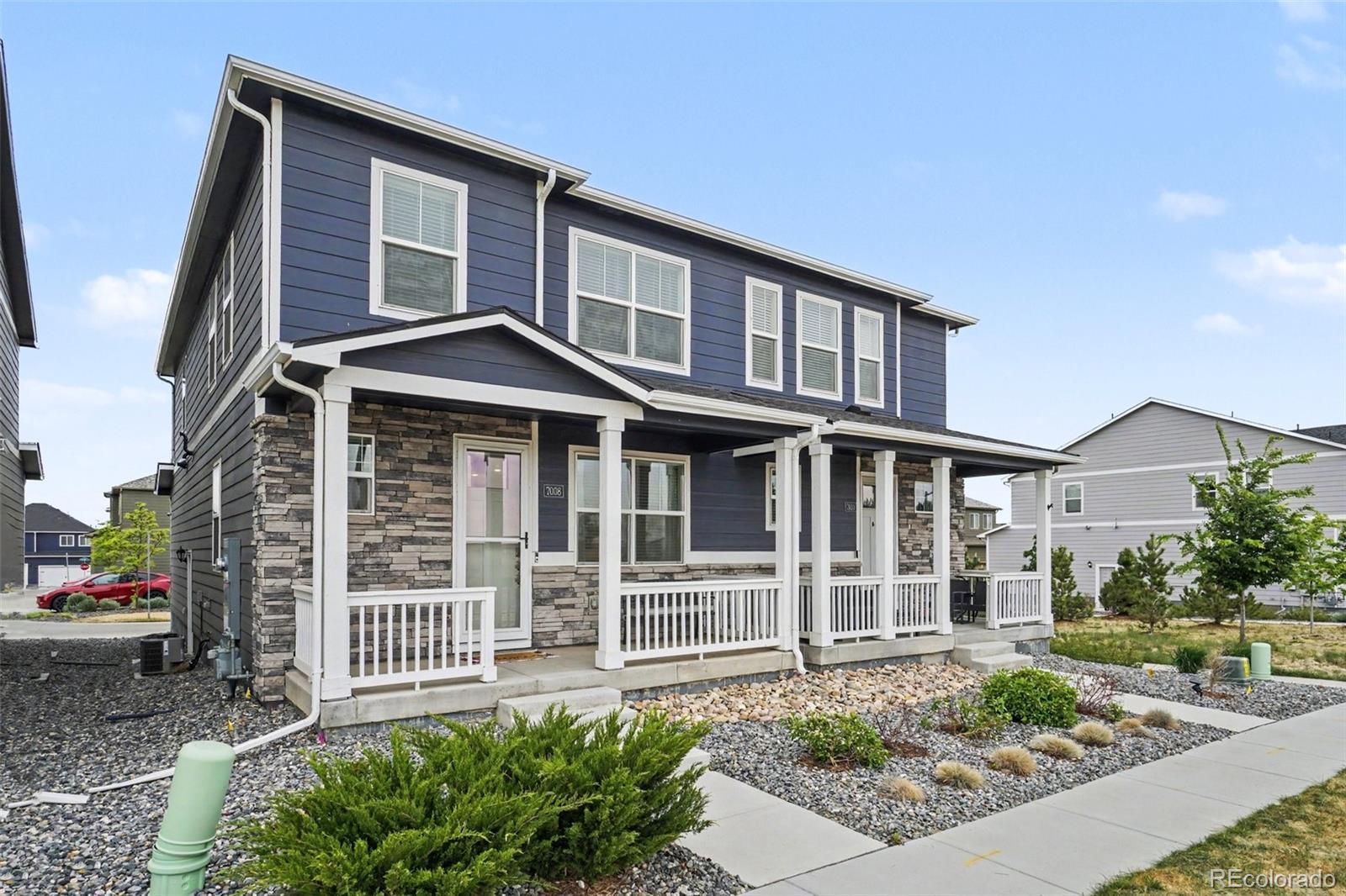 7008 Kali Court Frederick, CO 80530 - Photo 2 of 28 a front view of a house with a porch