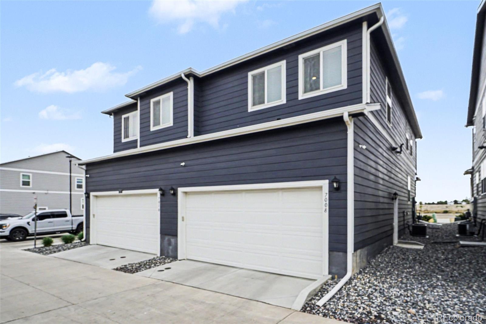 7008 Kali Court Frederick, CO 80530 - Photo 21 of 28 a front view of a house with parking space