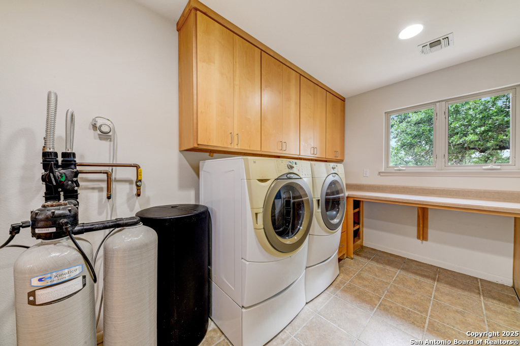 306 Fieldstone Johnson City, TX 78636 - Photo 13 of 31 a utility room with sink dryer and washer