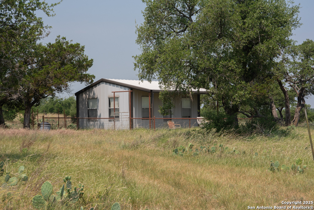 306 Fieldstone Johnson City, TX 78636 - Photo 24 of 31 a view of a house with a yard