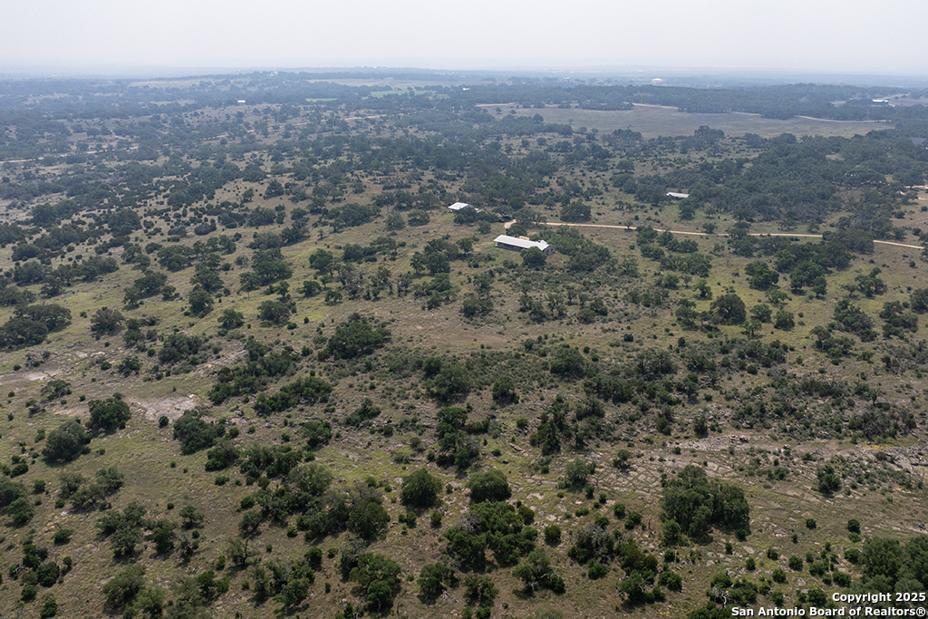 306 Fieldstone Johnson City, TX 78636 - Photo 31 of 31 an aerial view of house with yard and mountain view in back