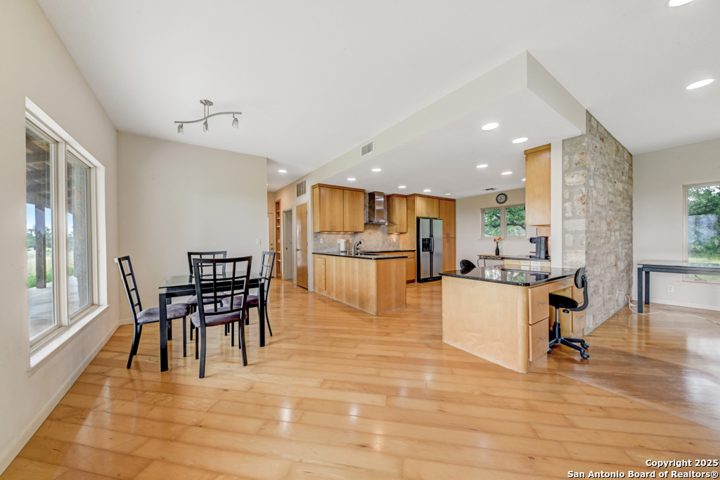 306 Fieldstone Johnson City, TX 78636 - Photo 6 of 31 a view of a kitchen with dining table and chairs