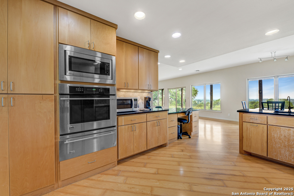 306 Fieldstone Johnson City, TX 78636 - Photo 8 of 31 a kitchen with stainless steel appliances a stove a sink and a refrigerator