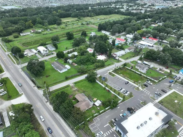 an aerial view of a residential houses with outdoor space