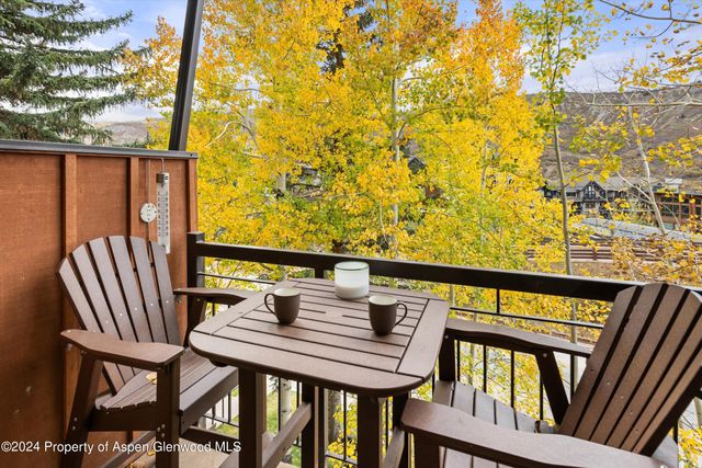 a view of a balcony with chairs