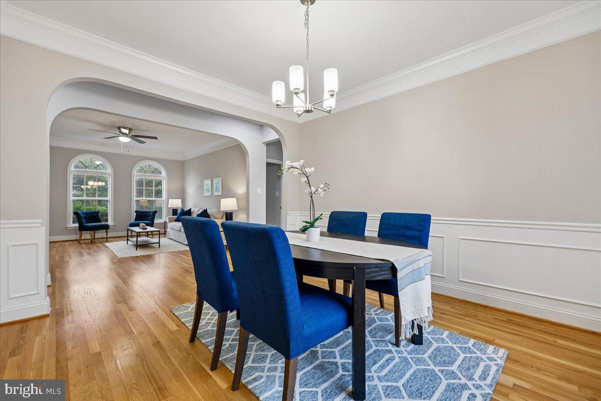 21712 Slidell Road Boyds, MD 20841 - Photo 7 of 32 a view of a dining room with furniture and wooden floor