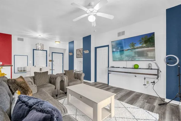 a living room with furniture and a window