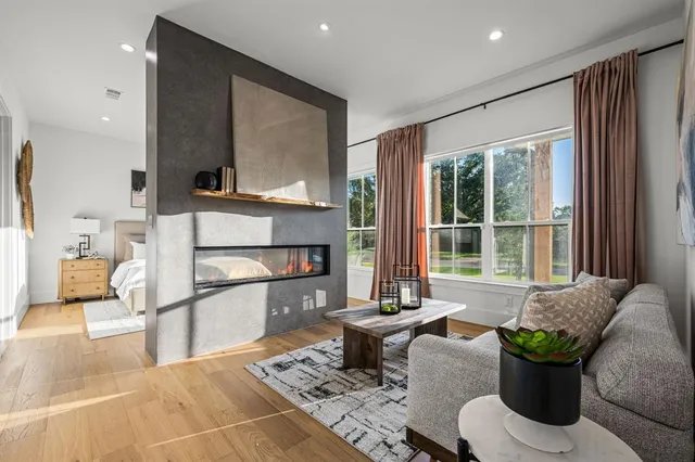 a living room with furniture and a potted plant