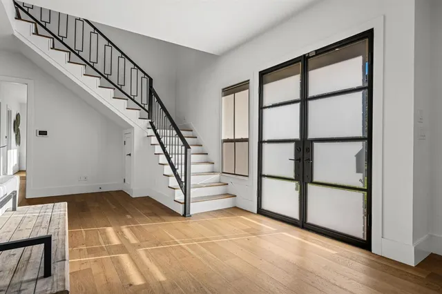 a view of entryway with wooden floor