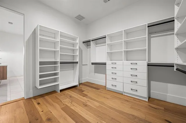 a view of an empty walk in closet