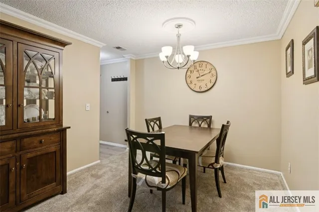 a view of dining area chandelier fan and wooden floor