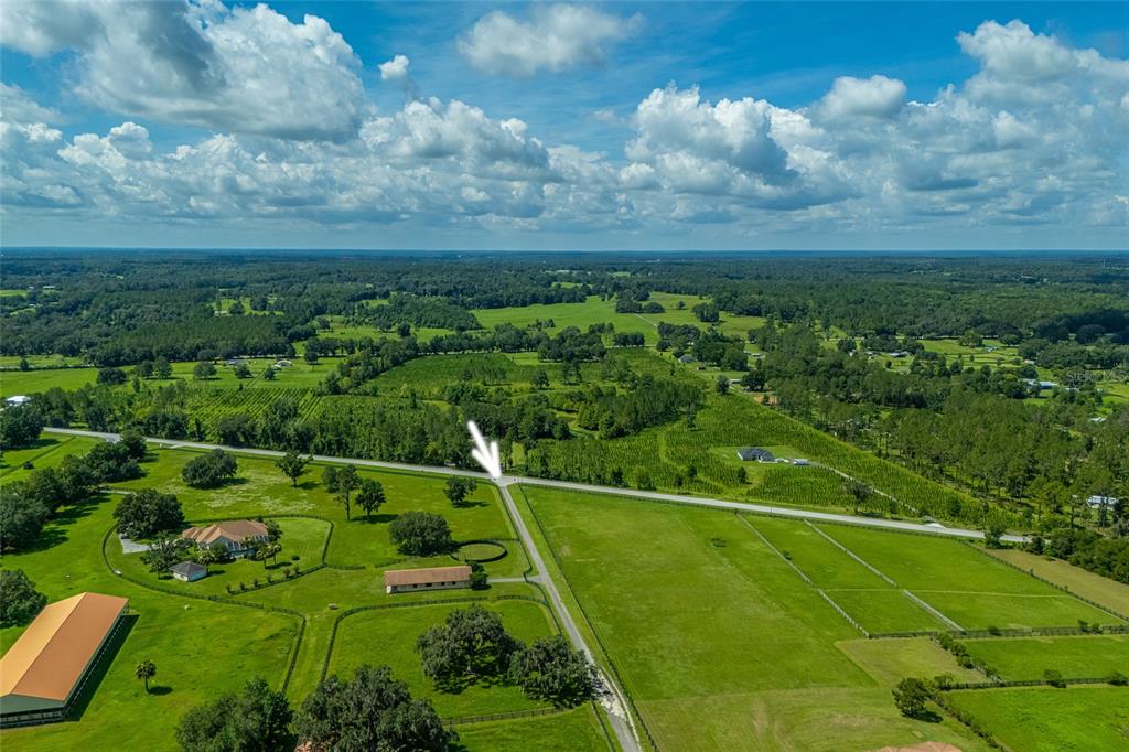 15795 Northwest 86th Avenue Reddick, FL 32686 - Photo 17 of 83 a view of a golf course with a wooden fence