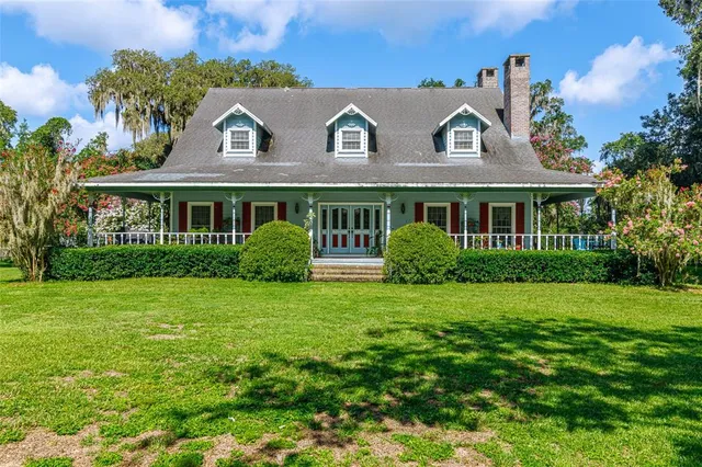 a view of a house with a garden
