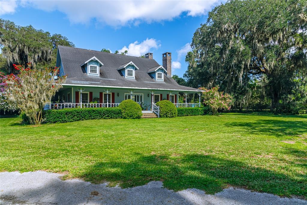 15795 Northwest 86th Avenue Reddick, FL 32686 - Photo 3 of 83 a view of a house with a yard