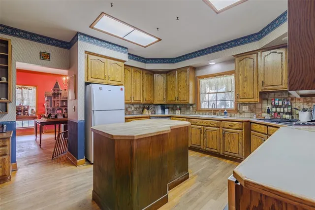 a view of a livingroom with furniture and a flat screen tv