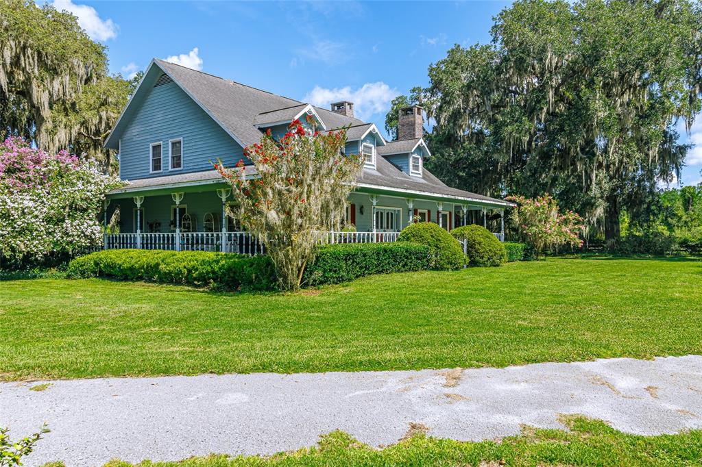 15795 Northwest 86th Avenue Reddick, FL 32686 - Photo 4 of 83 a front view of a house with a yard
