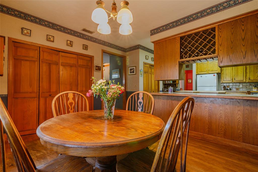 15795 Northwest 86th Avenue Reddick, FL 32686 - Photo 42 of 83 a view of a dining room with furniture window and wooden floor