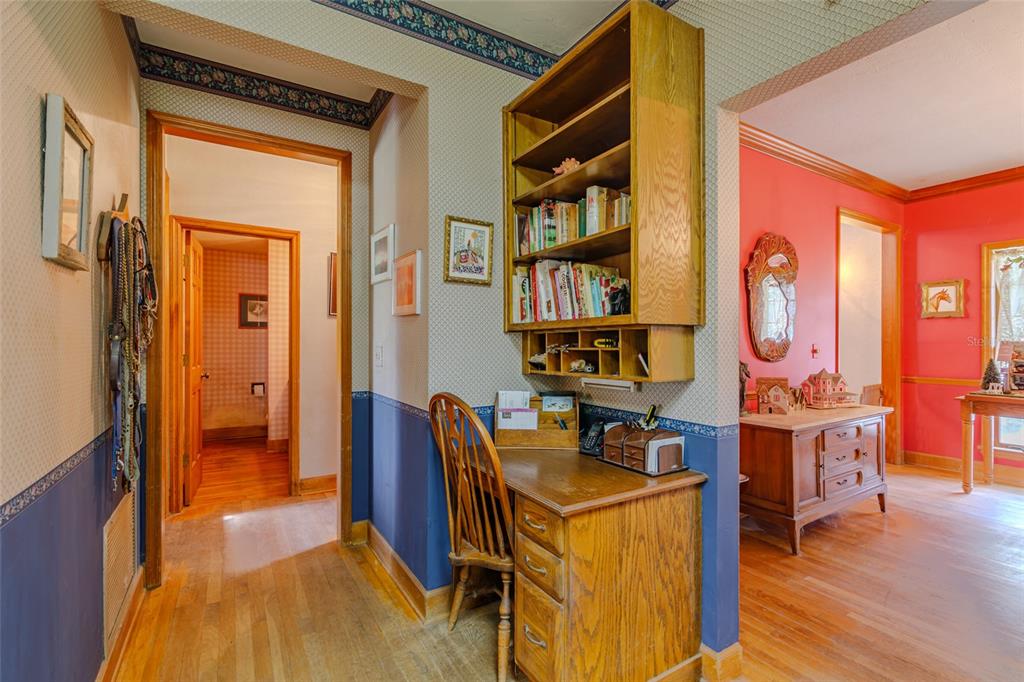 15795 Northwest 86th Avenue Reddick, FL 32686 - Photo 43 of 83 a view of a workspace with furniture and wooden floor