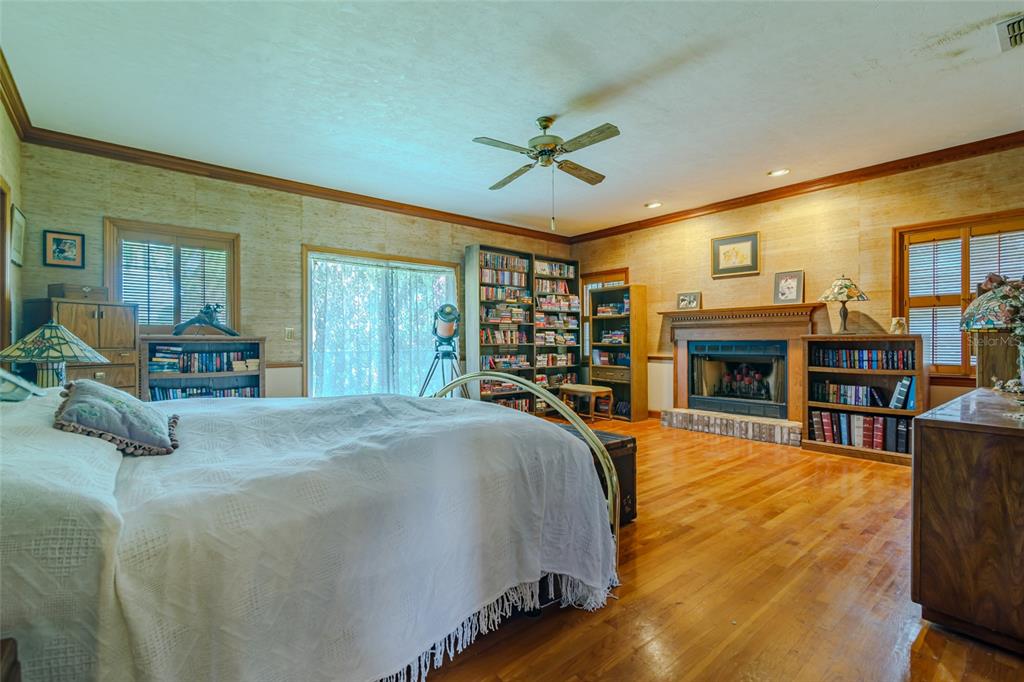 15795 Northwest 86th Avenue Reddick, FL 32686 - Photo 46 of 83 a bed room with a bed and a large window