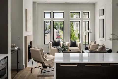 a view of a dining room with furniture and a window