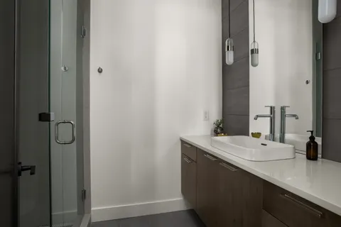 a bathroom with a sink and mirror